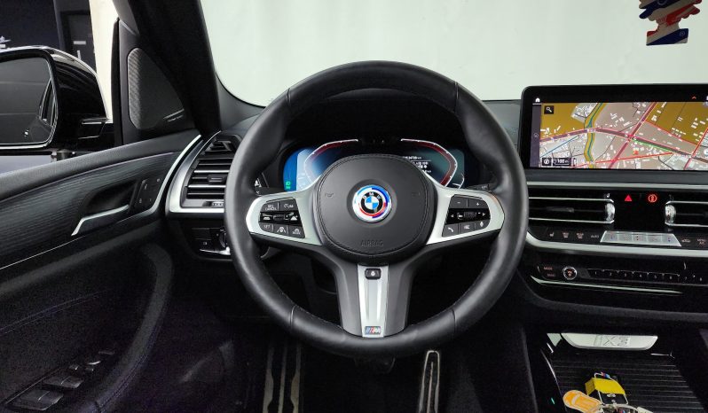 
								BMW iX3 M Sports full									